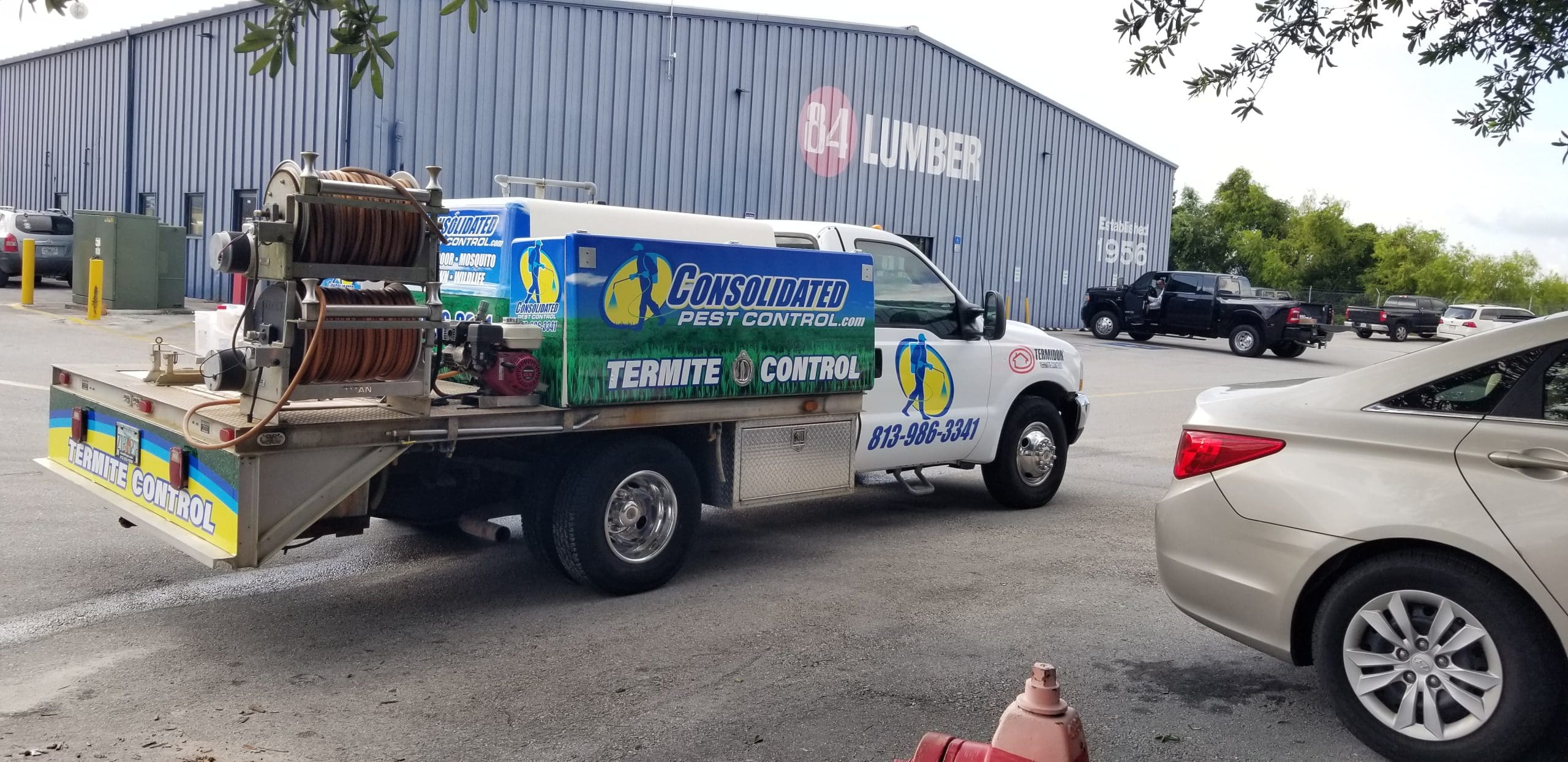 Pest control technician performing roach extermination Lakeland home interior inspection