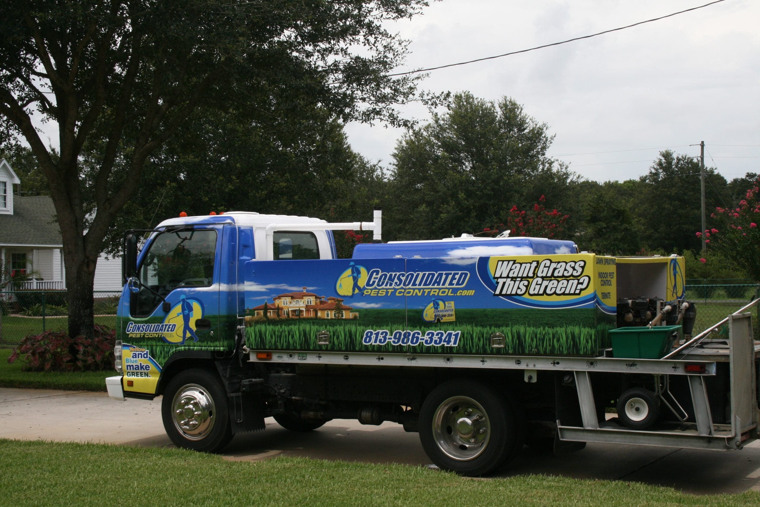 Technician performing wasp extermination Dade City property with professional spray equipment
