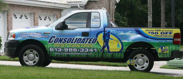 Pest control service truck ready for roach extermination Sun City Center neighborhood